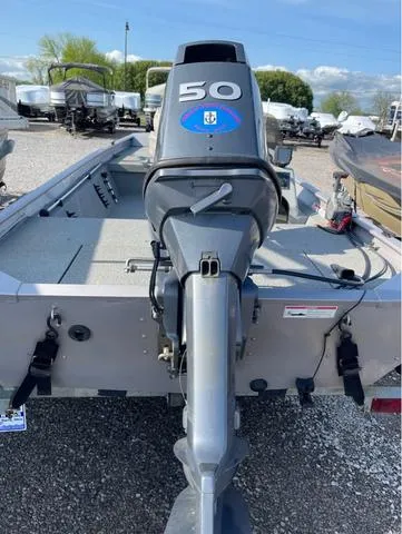 Slide: The Image of 2008 G3 1610 boat with 50 HP outboard motor, parked in a lot. - 4