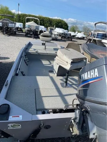 Slide: The Image of 2008 G3 1610 boat with Yamaha motor, parked outdoors in a marina. - 5