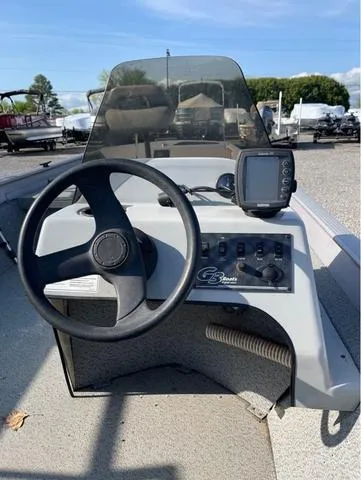Slide: The Image of Steering console of a 2008 G3 1610 boat with control panel and GPS device. - 7