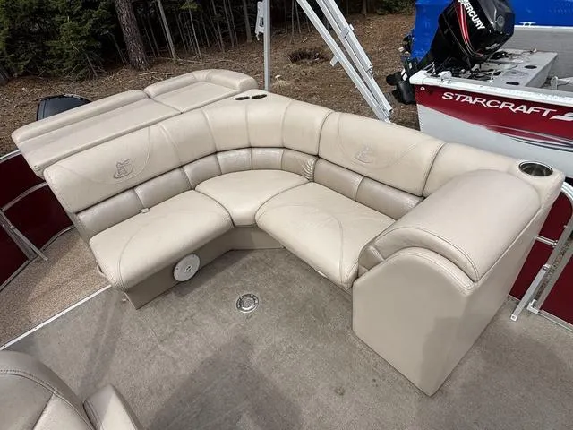 Slide: The Image of 2014 Misty Harbor Boats CR 225 pontoon with beige seating and cup holders. - 11