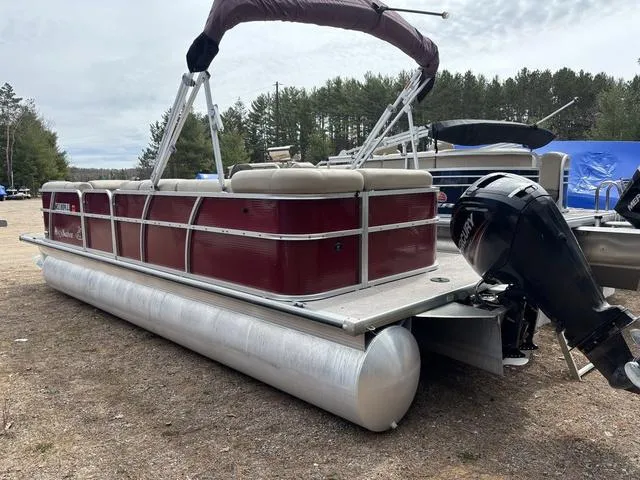 Slide: The Image of 2014 Misty Harbor Boats CR 225 pontoon with maroon exterior, parked outdoors. - 4