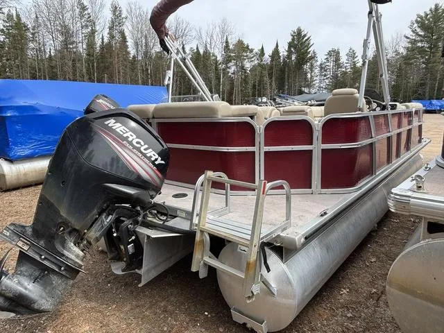 Slide: The Image of 2014 Misty Harbor Boats CR 225 pontoon with Mercury outboard motor, parked outdoors. - 6