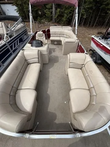 Slide: The Image of 2014 Misty Harbor Boats CR 225 pontoon with spacious beige seating and canopy. - 8