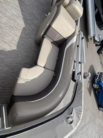 Slide: The Image of 2020 Bennington 22 SSX boat interior with beige seating and gray flooring. - 14