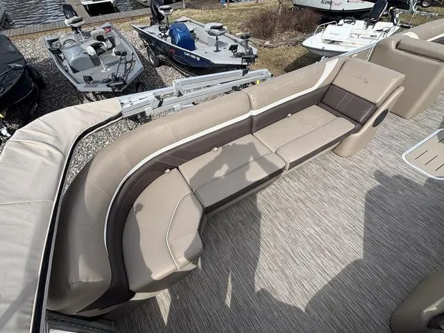 Slide: The Image of 2020 Bennington 22 SSX boat interior with beige seating and carpeted flooring. - 15