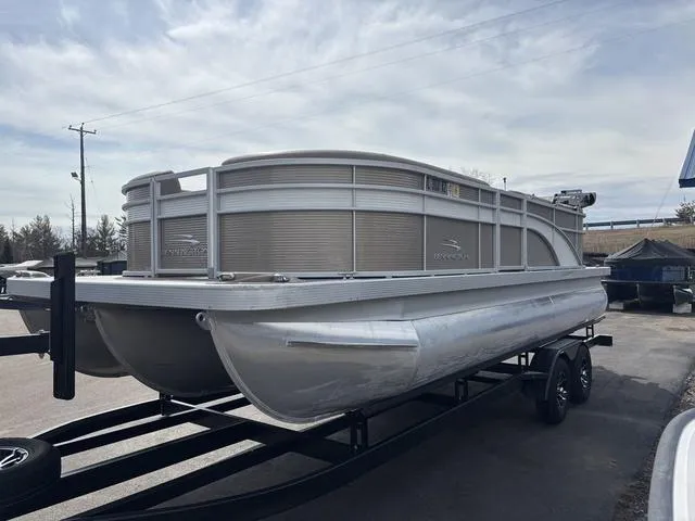 Slide: The Image of 2020 Bennington 22 SSX pontoon boat on trailer, parked outdoors. - 4