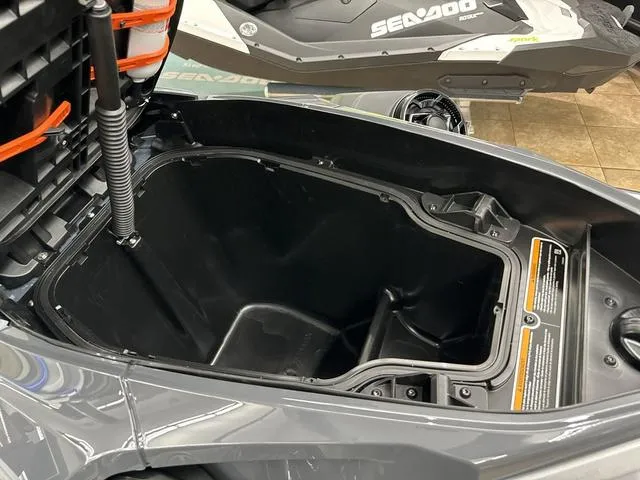 Slide: The Image of 2025 Sea-Doo Waverunner RXT-X storage compartment, open and empty, showcasing interior space. - 12
