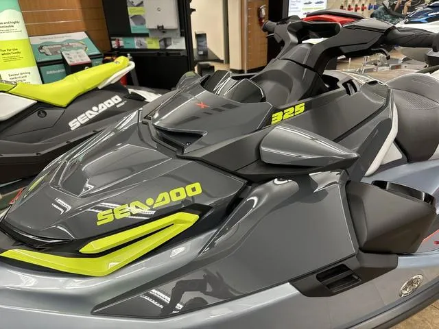 Slide: The Image of 2025 Sea-Doo Waverunner RXT-X, sleek gray design with vibrant yellow accents. - 15