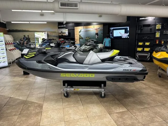 Slide: The Image of 2025 Sea-Doo RXT-X Waverunner displayed in a showroom. - 3