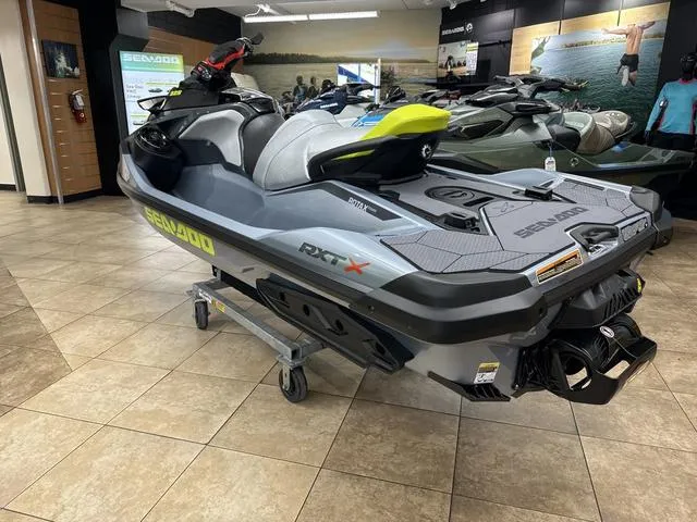 Slide: The Image of 2025 Sea-Doo Waverunner RXT-X on display in a showroom. - 4