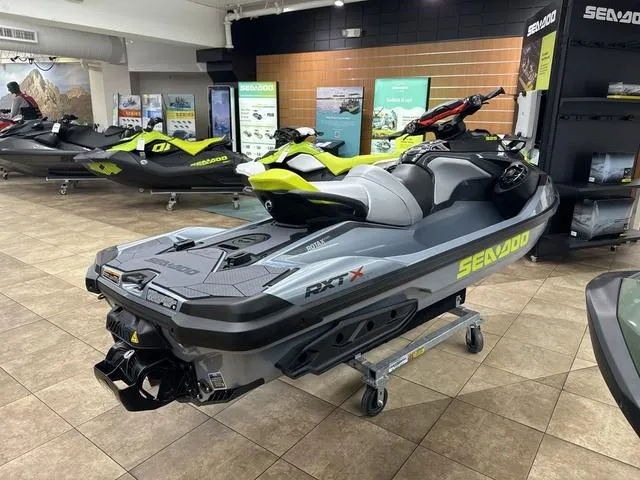 Slide: The Image of 2025 Sea-Doo RXT-X Waverunner displayed in a showroom, showcasing sleek design and features. - 6