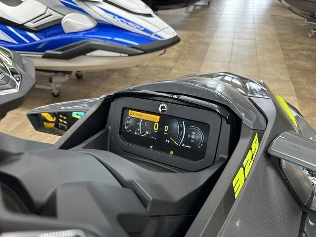 Slide: The Image of 2025 Sea-Doo Waverunner RXT-X dashboard display in showroom setting. - 9