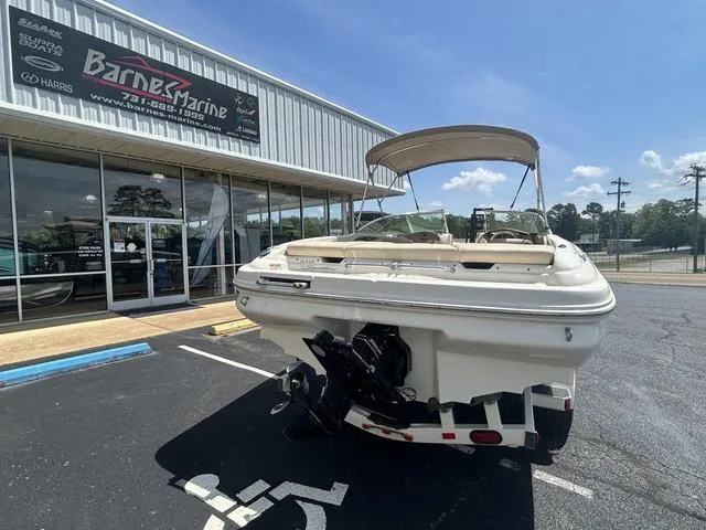 Slide: The Image of Sea Ray 210 Signature boat, 2000 model, parked outside Barner Marine dealership. - 2
