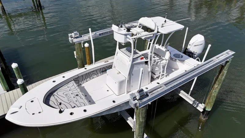 Slide: The Image of 2022 Xplor x24 Andros Mercury 300 boat with tower, docked on lift. - 0
