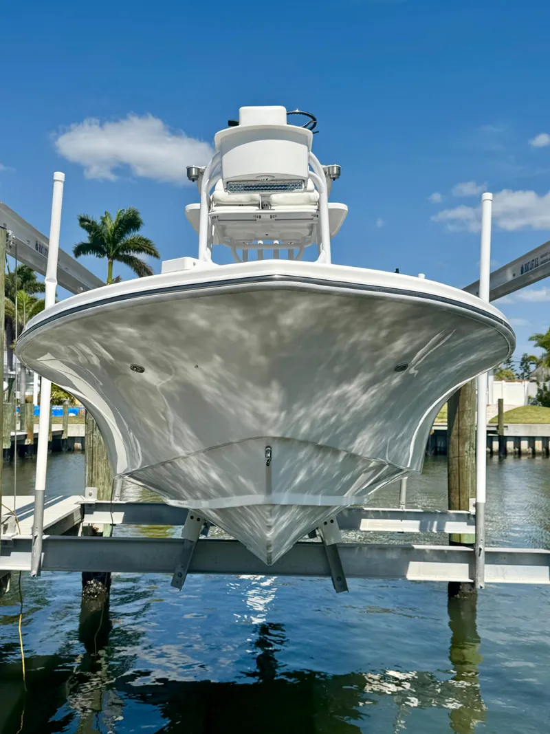 Slide: The Image of 2022 Xplor x24 Andros Mercury 300 boat with tower, docked on lift. - 10