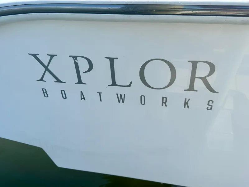 Slide: The Image of Xplor Boatworks logo on 2022 Xplor x24 Andros Mercury 300 boat. - 11