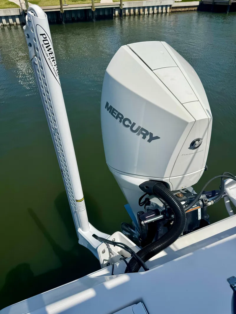 Slide: The Image of 2022 Xplor x24 Andros Mercury 300 outboard engine on water, featuring Power-Pole anchor. - 12
