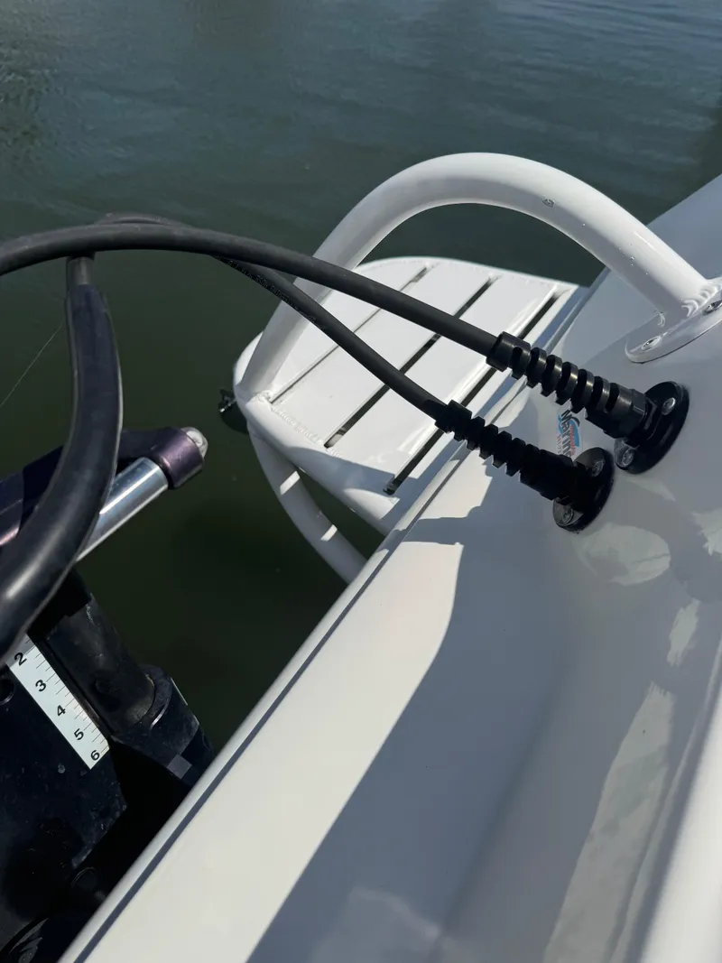 Slide: The Image of 2022 Xplor x24 Andros Mercury 300 boat with tower, showing engine controls and ladder. - 13