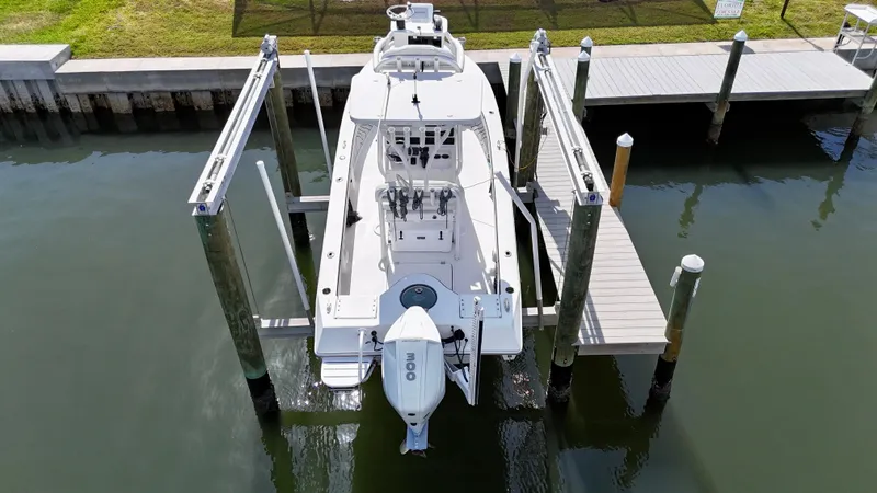 Slide: The Image of 2022 Xplor x24 Andros Mercury 300 boat docked with tower, aerial view. - 2