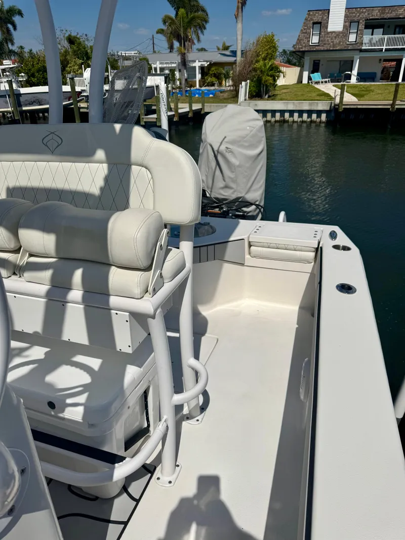 Slide: The Image of 2022 Xplor x24 Andros Mercury boat with tower, docked in a sunny marina. - 26