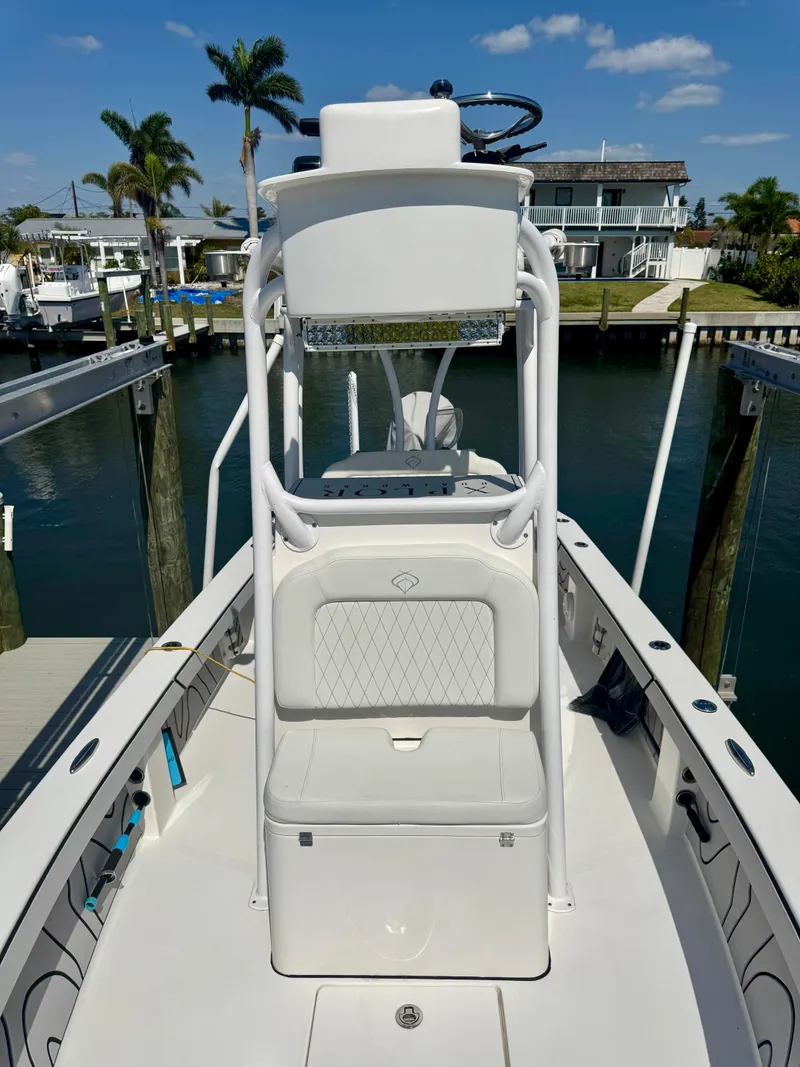 Slide: The Image of 2022 Xplor x24 Andros Mercury 300 boat with tower, docked in sunny marina. - 27