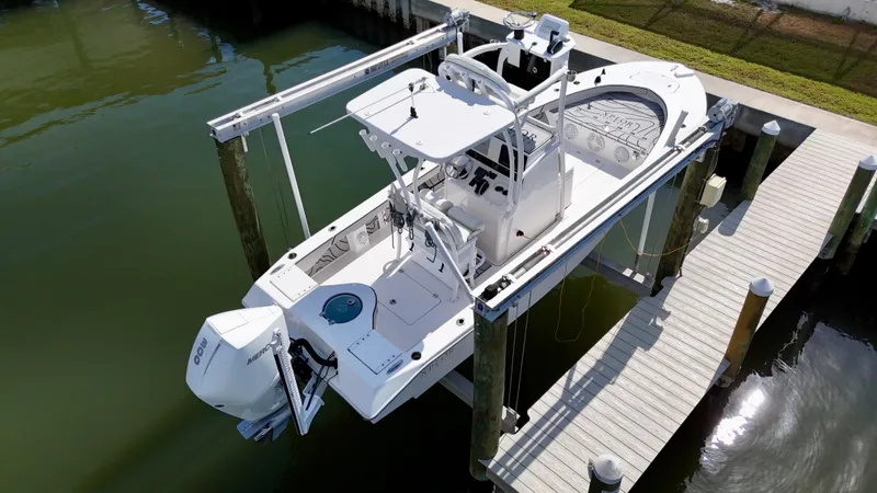 Slide: The Image of 2022 Xplor x24 Andros Mercury 300 boat with tower, docked on a lift. - 3