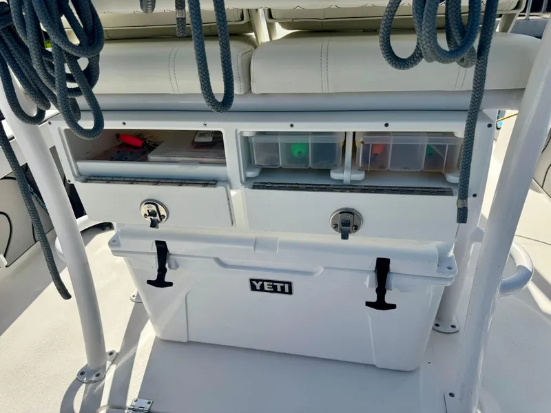 Slide: The Image of 2022 Xplor x24 Andros Mercury boat with storage compartments and Yeti cooler. - 31