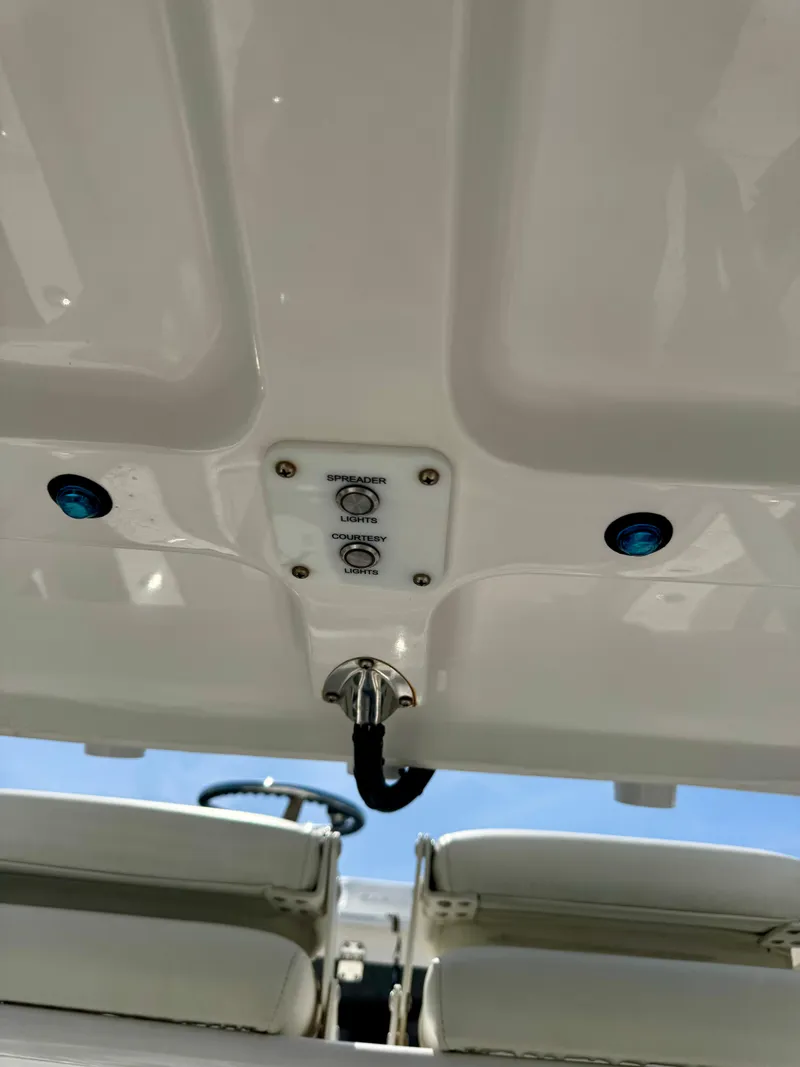 Slide: The Image of 2022 Xplor x24 Andros Mercury 300 boat tower controls and lights, viewed from below. - 38