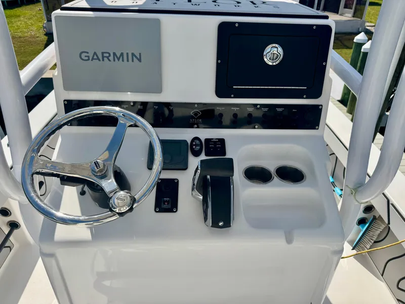 Slide: The Image of 2022 Xplor x24 Andros Mercury boat console with Garmin system and steering wheel. - 39