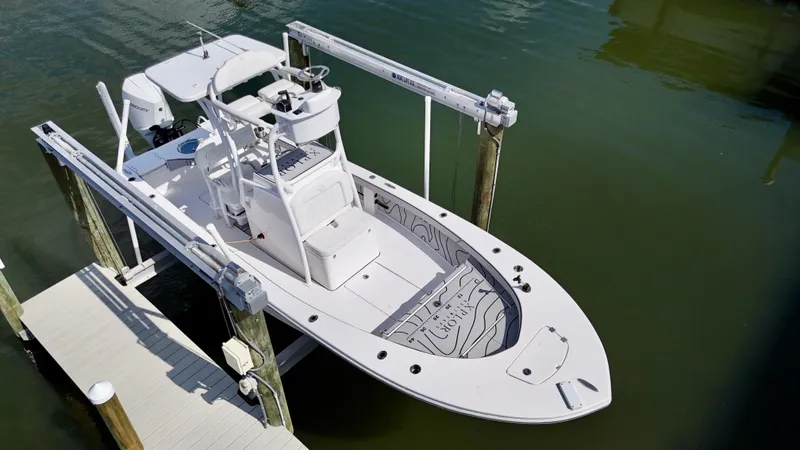 Slide: The Image of 2022 Xplor x24 Andros Mercury 300 boat with tower, docked on lift. - 4