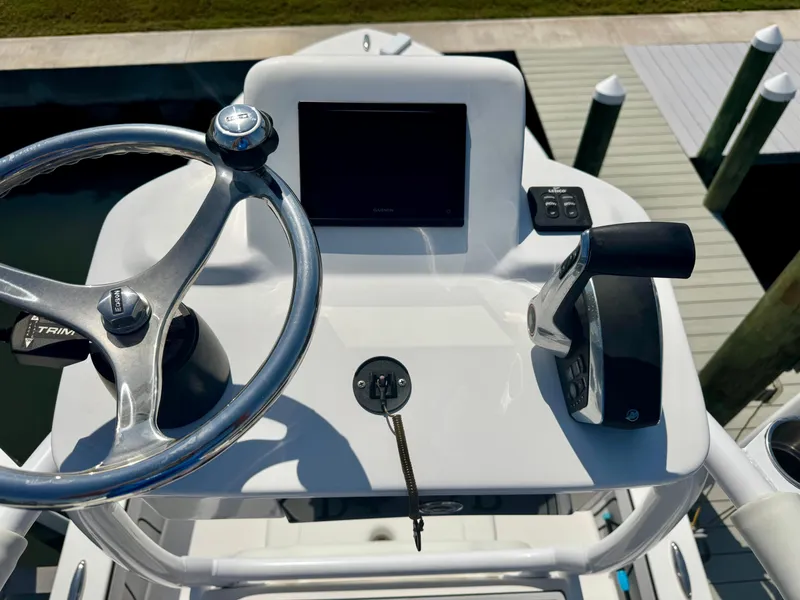 Slide: The Image of 2022 Xplor x24 Andros Mercury 300 boat helm with steering wheel and controls. - 44