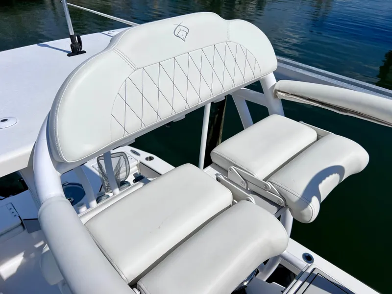 Slide: The Image of White leather seating on 2022 Xplor x24 Andros Mercury 300 boat, featuring elegant stitching. - 46
