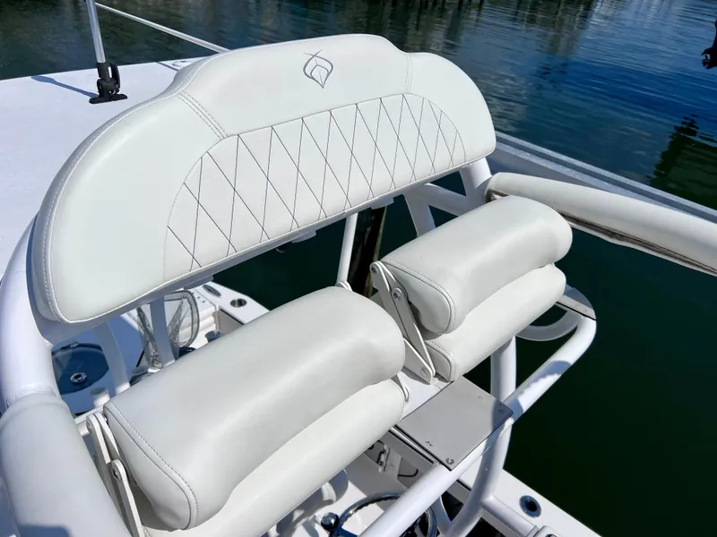 Slide: The Image of 2022 Xplor x24 Andros Mercury 300 boat seat with white cushioned backrest and armrests. - 47