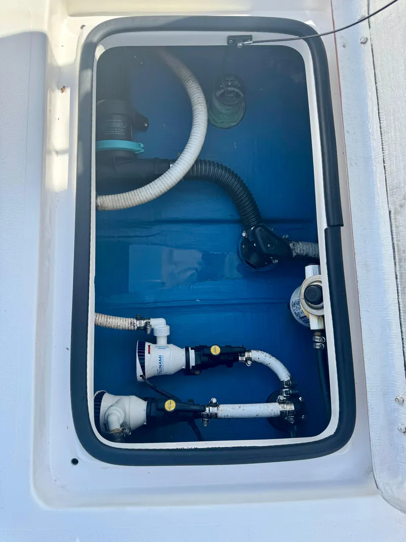 Slide: The Image of Boat compartment with hoses and fittings, Xplor x24 Andros Mercury 300, 2022 model. - 49