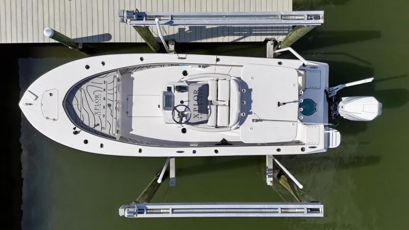 Slide: The Image of 2022 Xplor x24 Andros Mercury 300 boat with tower, docked aerial view. - 8