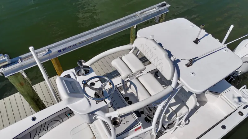 Slide: The Image of 2022 Xplor x24 Andros Mercury 300 boat with tower, docked on calm water. - 9