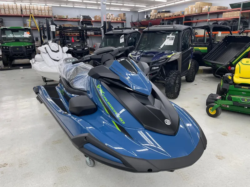 Slide: The Image of 2025 Yamaha WaveRunner VX Cruiser HO in showroom, blue and black design. - 2