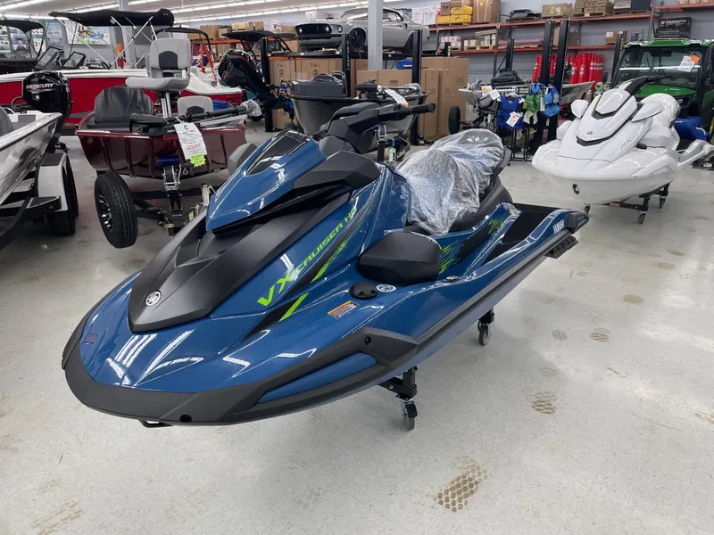 Slide: The Image of 2025 Yamaha WaveRunner VX Cruiser HO in showroom, blue color, sleek design. - 4