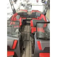 Slide: The Image of 2024 Starcraft MVX Surf boat interior with red and gray seating. - 6