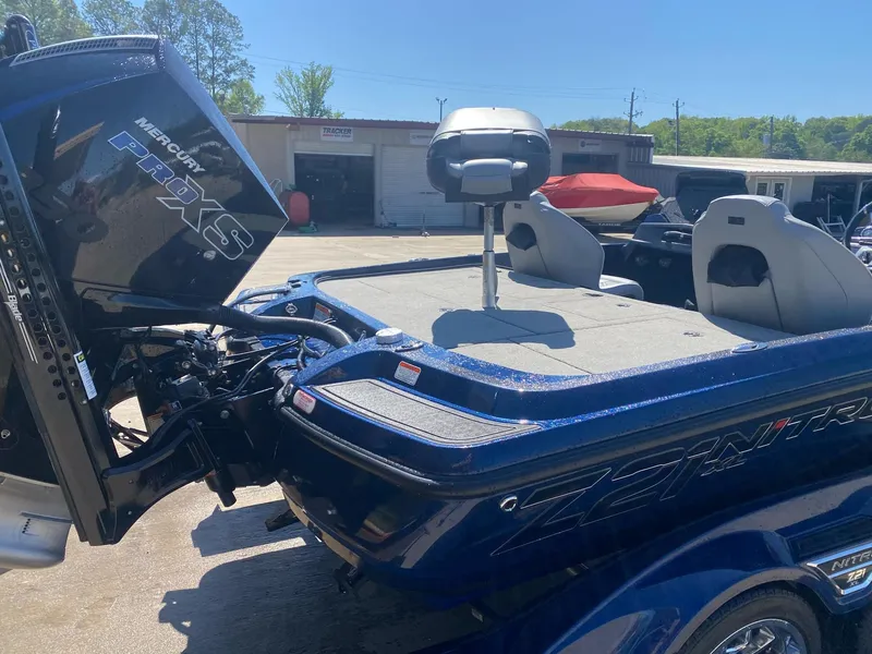 Slide: The Image of 2022 Nitro Z21 XL Pro boat with Mercury engine, parked outdoors. - 5