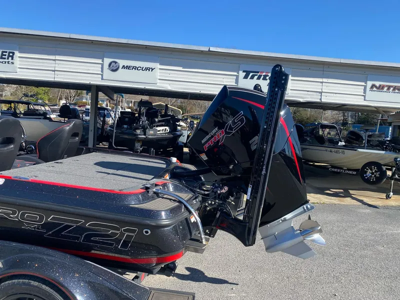 Slide: The Image of 2023 Nitro Z21 XL Pro boat with powerful Mercury engine displayed outdoors. - 5