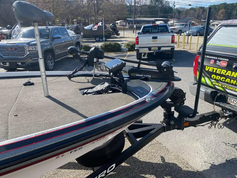 Slide: The Image of 2020 Nitro Z21 Pro boat with Minn Kota trolling motor in a parking lot. - 10