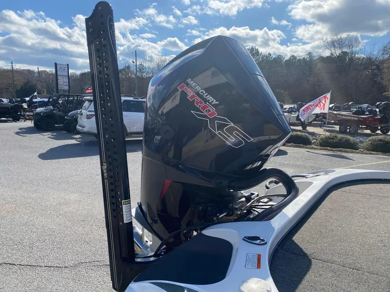 Slide: The Image of 2020 Nitro Z21 Pro boat with Mercury Pro XS engine in a parking lot. - 6