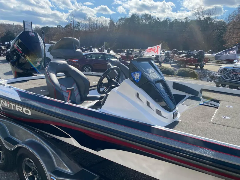 Slide: The Image of 2020 Nitro Z21 Pro boat with sleek design, parked outdoors under a sunny sky. - 9
