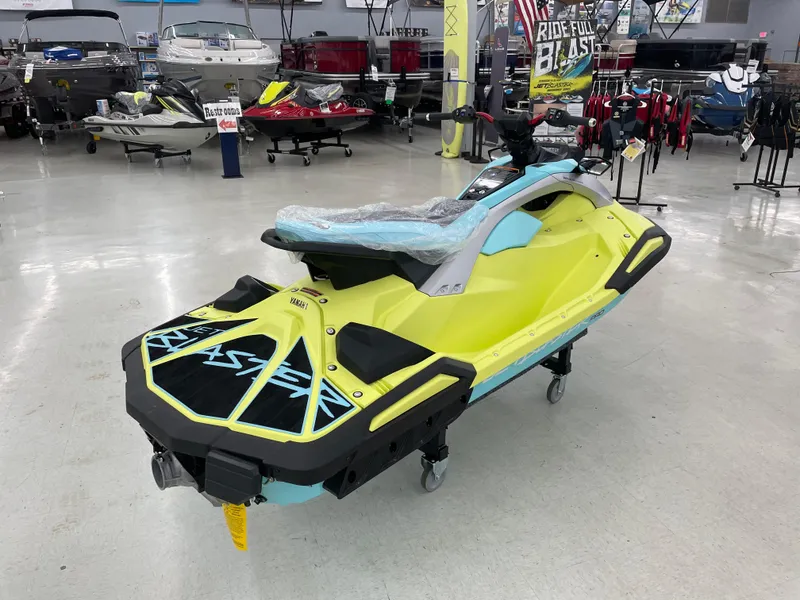 Slide: The Image of 2025 Yamaha WaveRunner JetBlaster PRO 3-Up in showroom, vibrant yellow and blue design. - 5