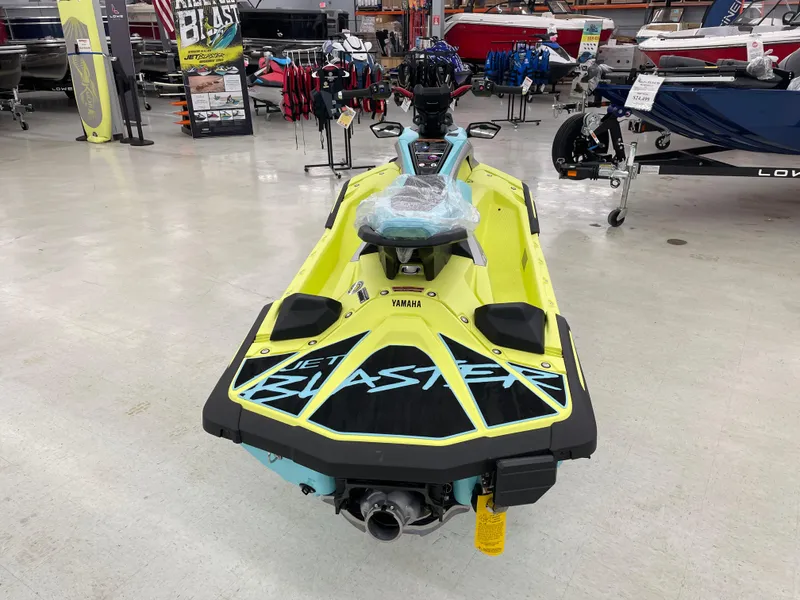 Slide: The Image of 2025 Yamaha WaveRunner JetBlaster PRO 3-Up in showroom, vibrant yellow design. - 6