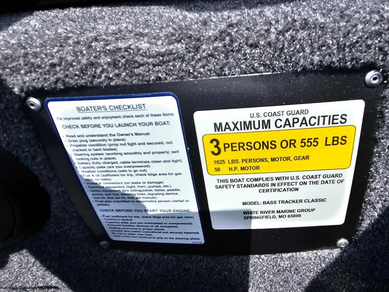 Slide: The Image of 2025 Tracker Bass Tracker Classic XL capacity label and boater's checklist. - 13