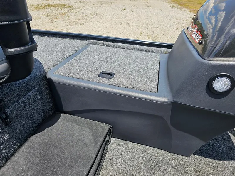 Slide: The Image of 2025 Tracker Bass Tracker Classic XL boat interior with storage compartment and seating. - 16