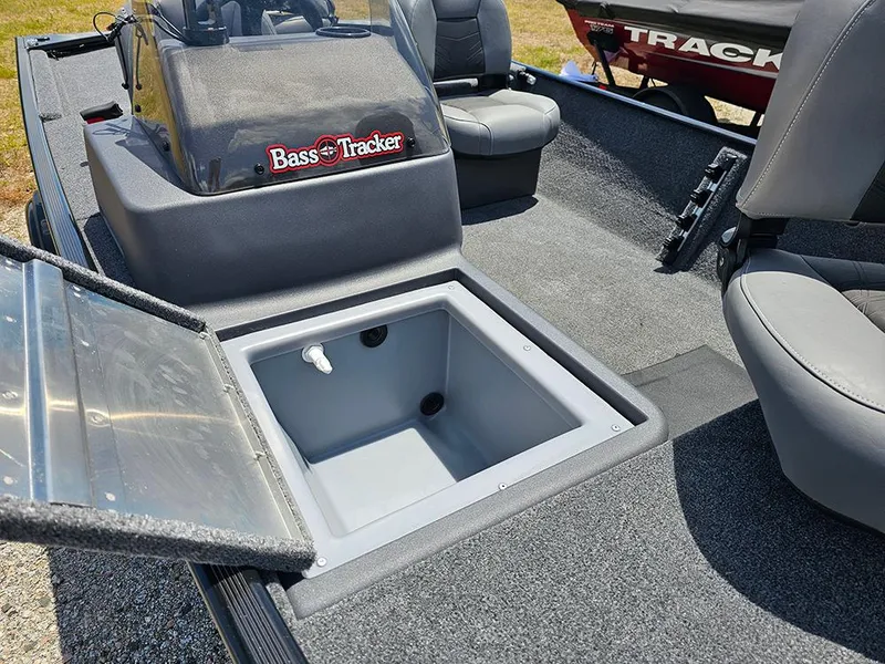 Slide: The Image of 2025 Tracker Bass Tracker Classic XL boat interior with open storage compartment. - 17