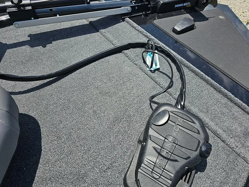 Slide: The Image of 2025 Tracker Bass Tracker Classic XL boat deck with Minn Kota trolling motor pedal. - 18